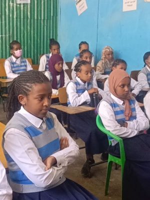 Woman focused on laptop during remote work from home.